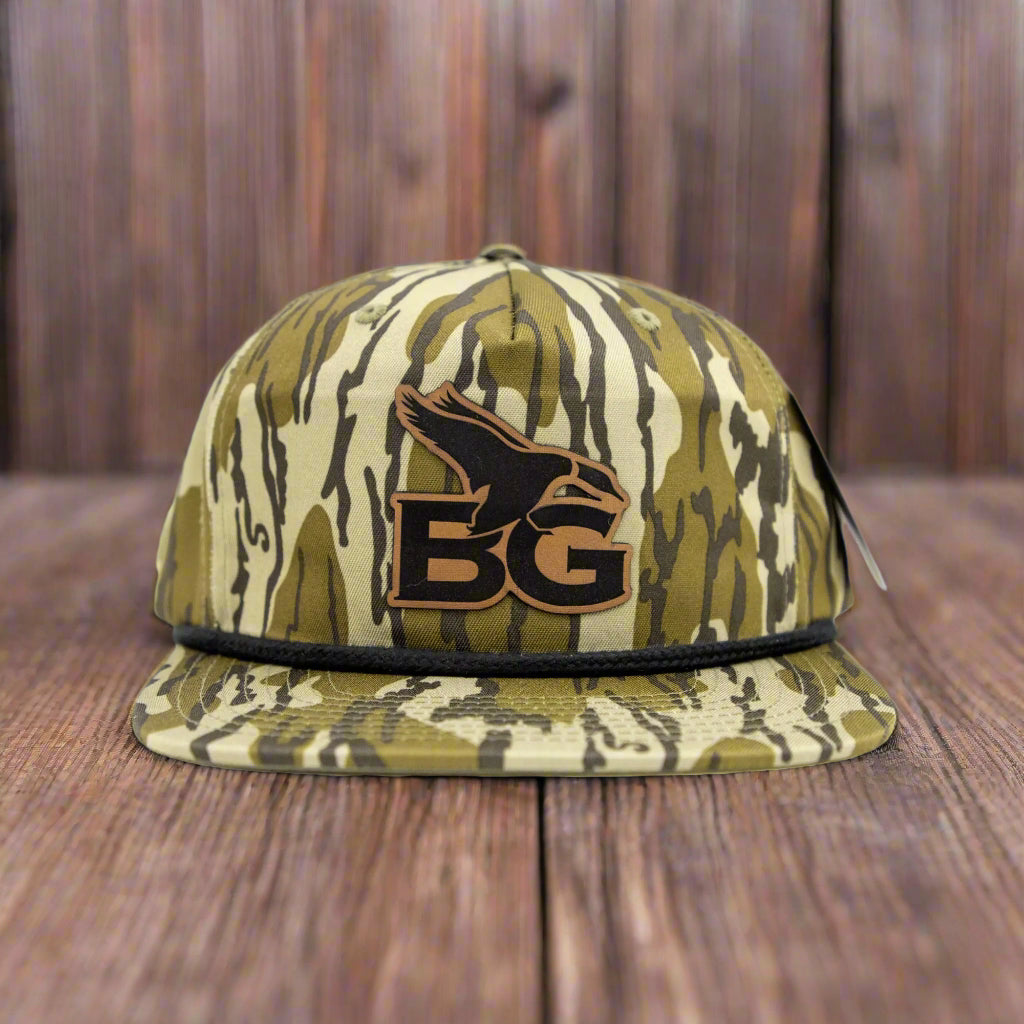Camouflage-patterned cap with a logo on a white background