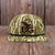 Camouflage-patterned cap with a logo on a white background